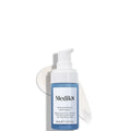 Medik8 skincare bottle with pump on a white background